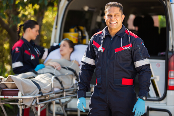 Eastern Royal Medical Transport crew preparing a patient stretcher for long-distance ground transport